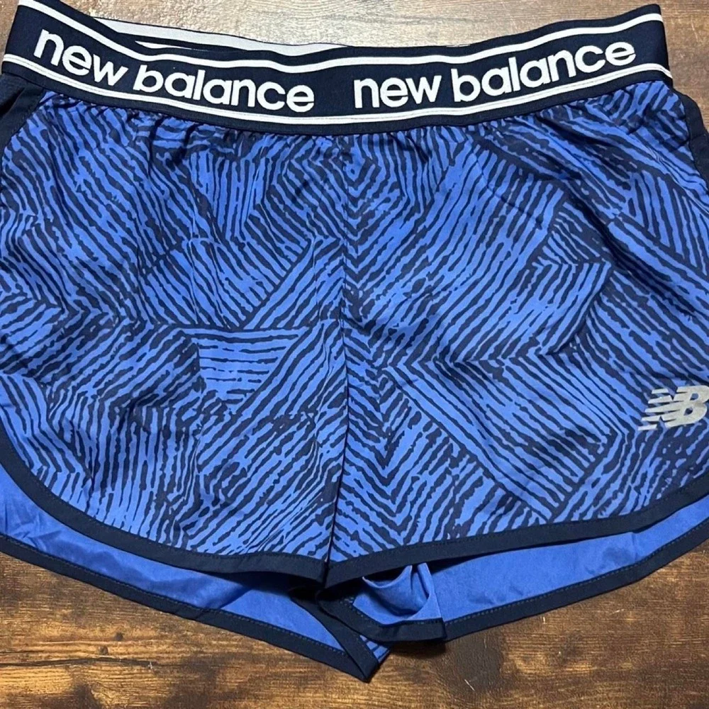 New Balance blue shorts with black diagonal stripes 425.5